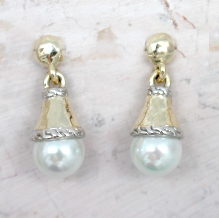 A photo of the Drop Cone Earrings product