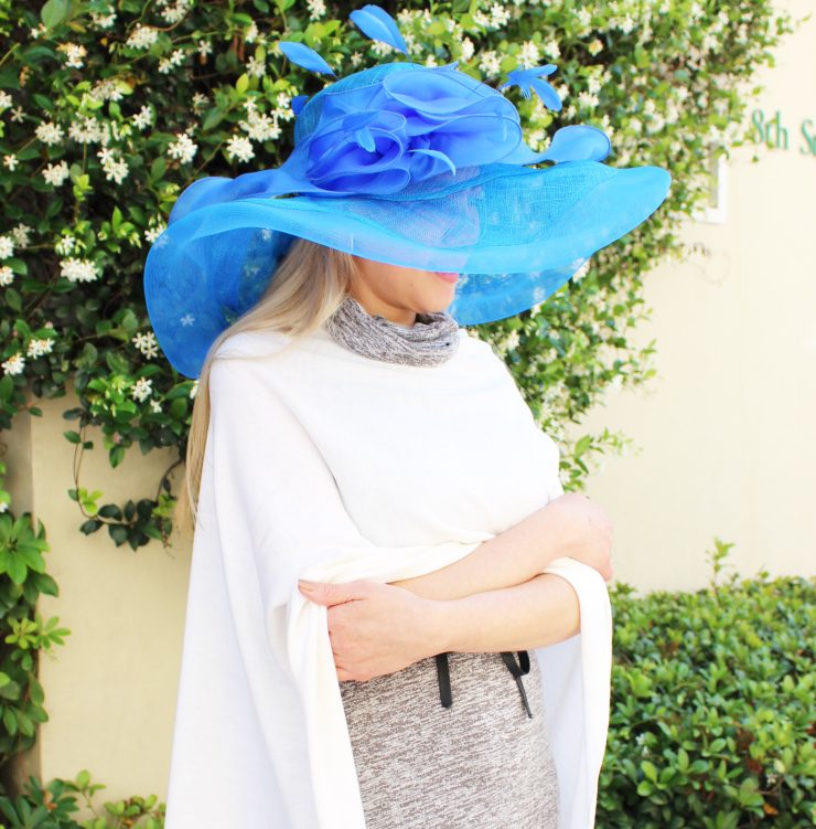 A photo of the Large Blue Feather Fascinator Hat product