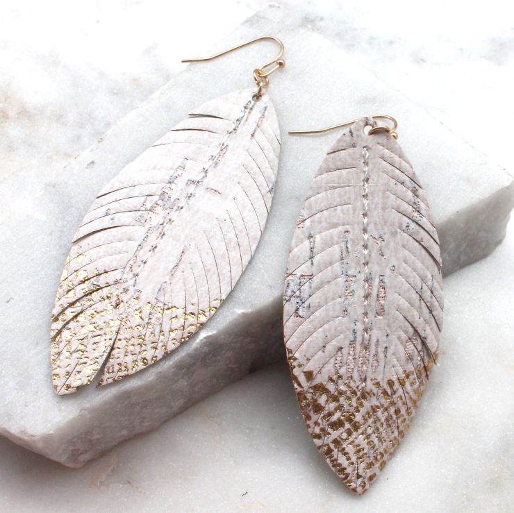 A photo of the Metallic Feather Earrings product