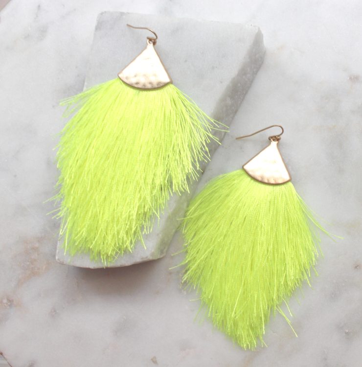 A photo of the Tassel Me Neon Earrings product