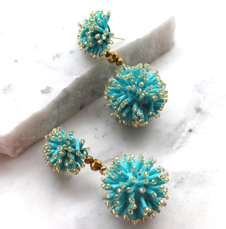 A photo of the Turquoise Burst Earrings product