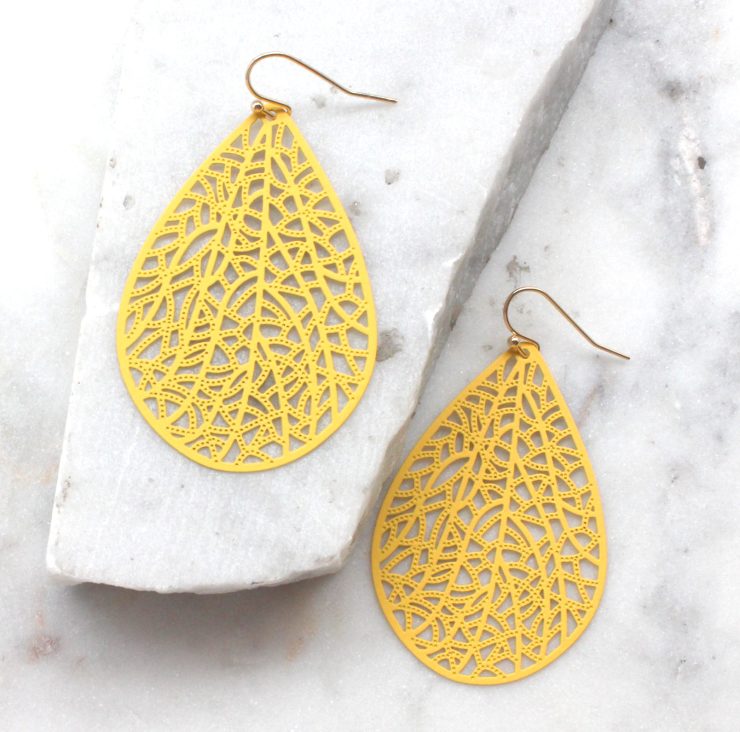A photo of the Cute Cutout Bright Earrings product
