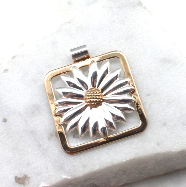 A photo of the Daisy Portrait Pendant product