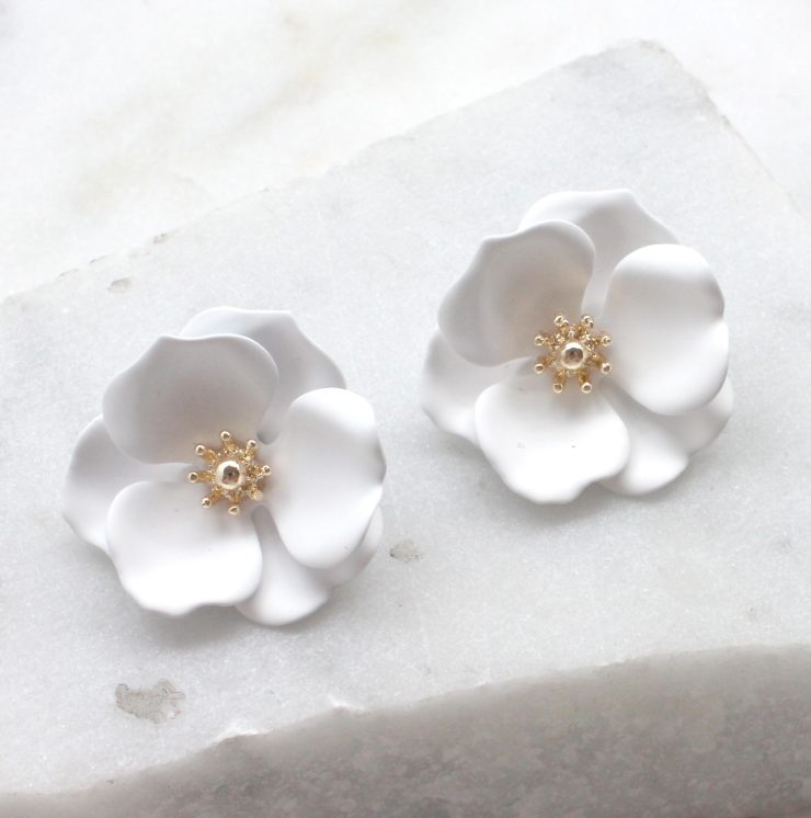 A photo of the Delicate Daisy Earrings product