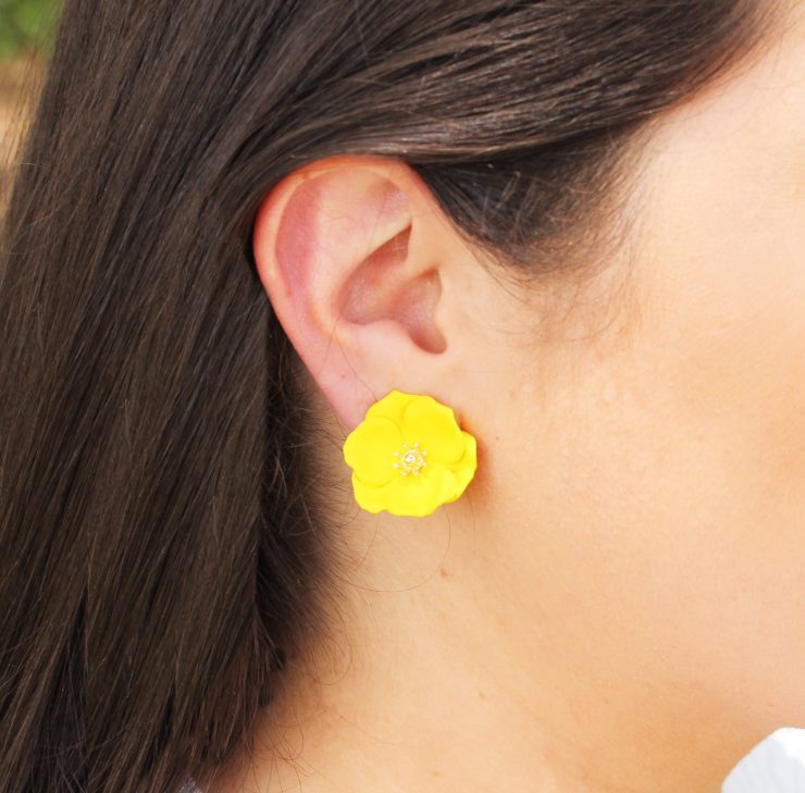 A photo of the Delicate Daisy Earrings product