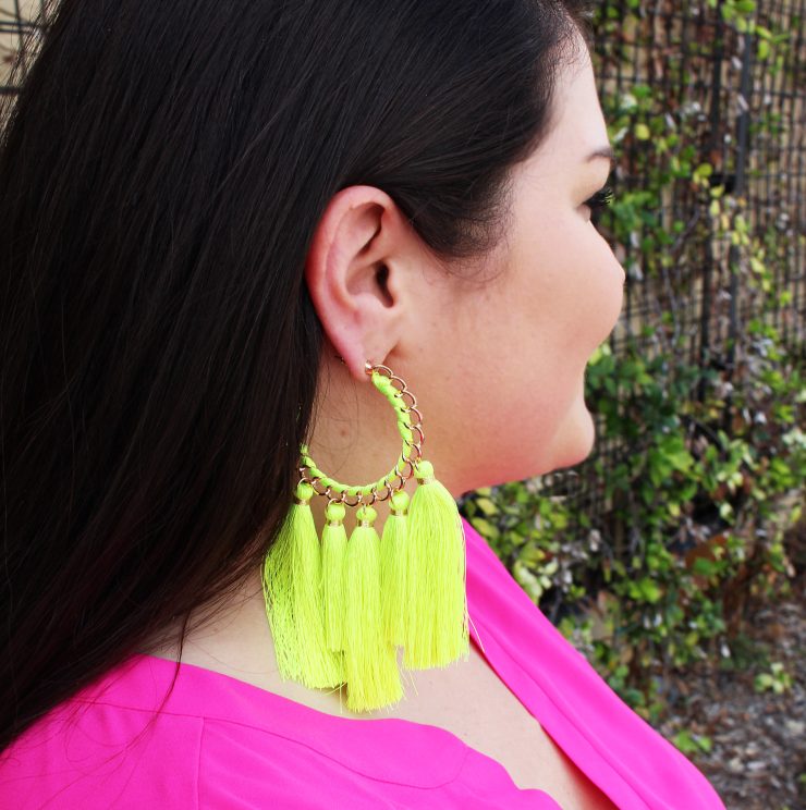 A photo of the Truly Neon Tassel Earrings product
