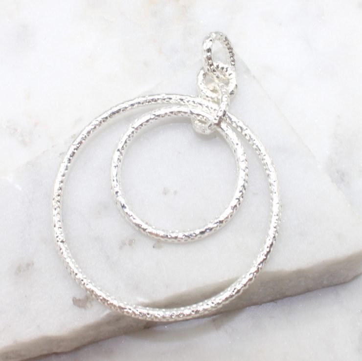 A photo of the Matte Ring Pendant product