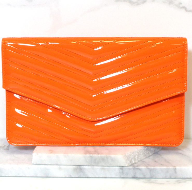 A photo of the Neon Envelope Clutch product