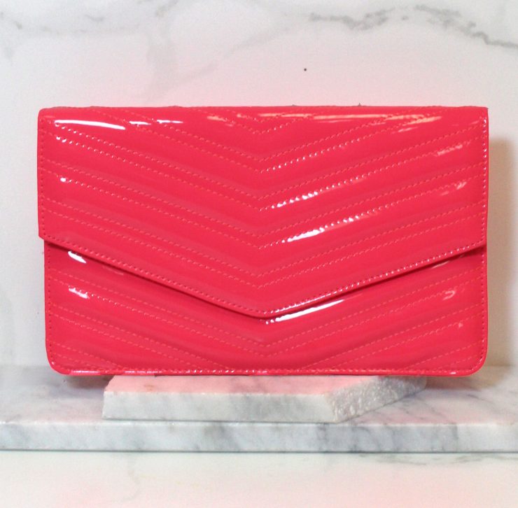 A photo of the Neon Envelope Clutch product