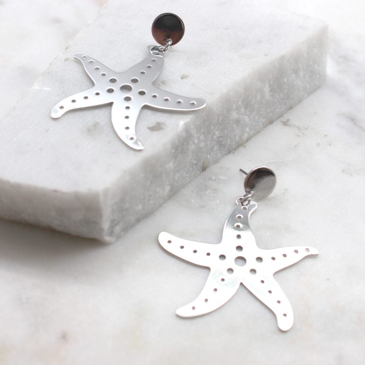 A photo of the Starfish Earrings product