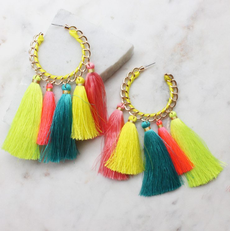A photo of the Truly Neon Tassel Earrings product