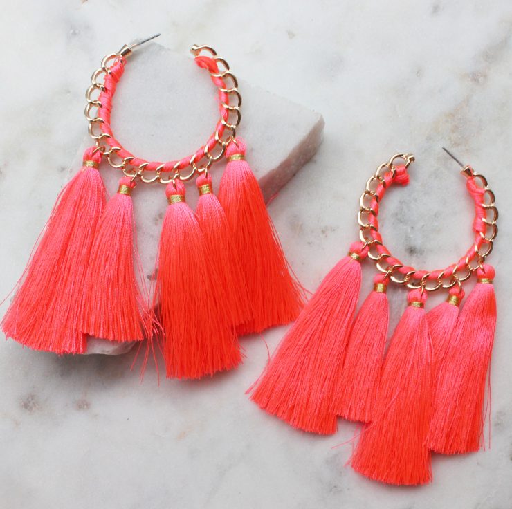 A photo of the Truly Neon Tassel Earrings product