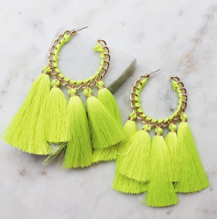 A photo of the Truly Neon Tassel Earrings product