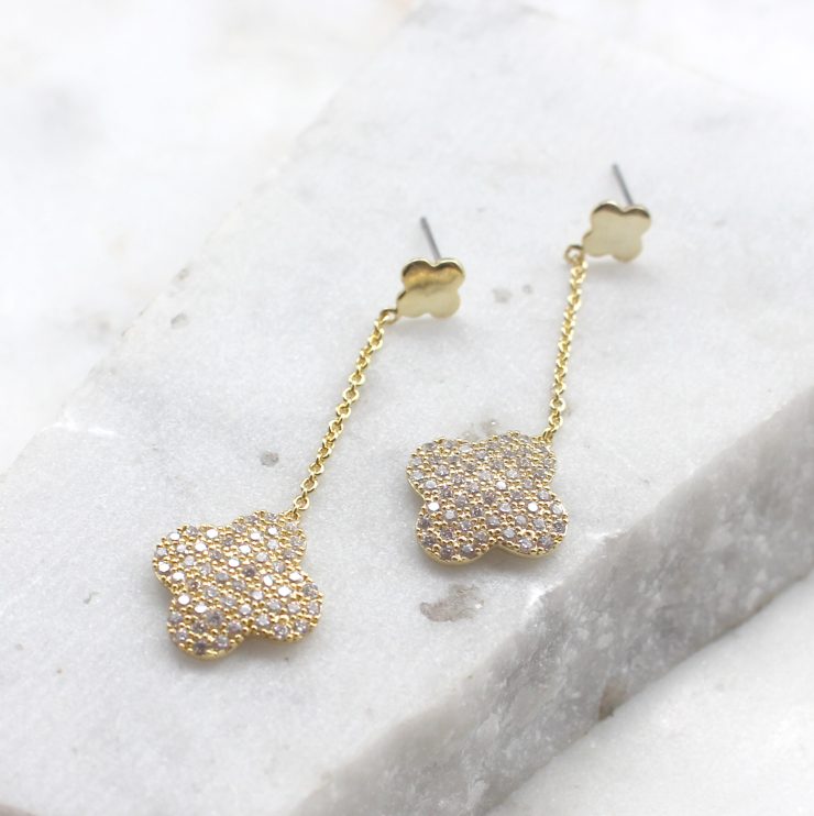 A photo of the Clover Dangle Earrings product