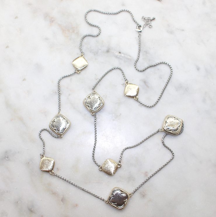 A photo of the Clover Pieces Necklace product