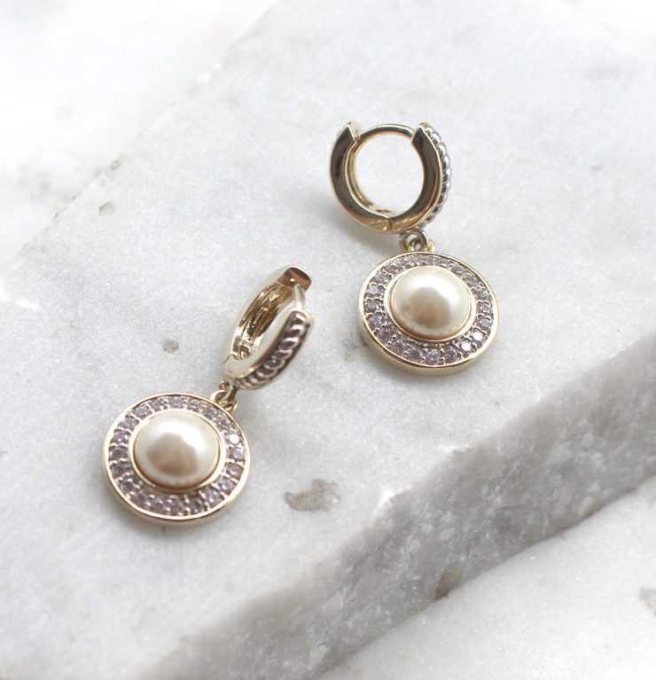 A photo of the Dangling Pearl Earrings product