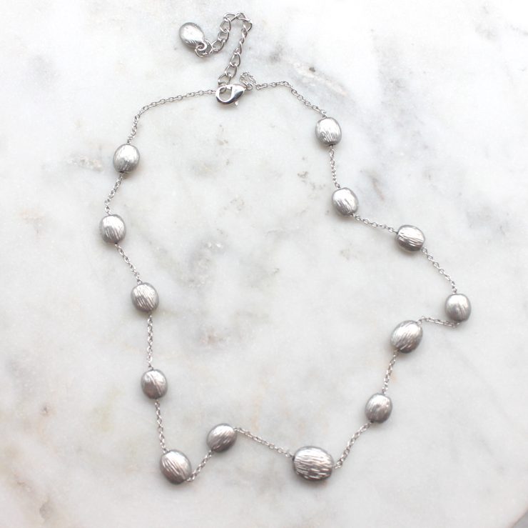 A photo of the Silver Beads Necklace product