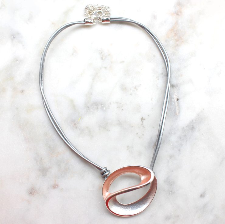 A photo of the Swirl Necklace product