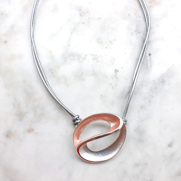 A photo of the Swirl Necklace product