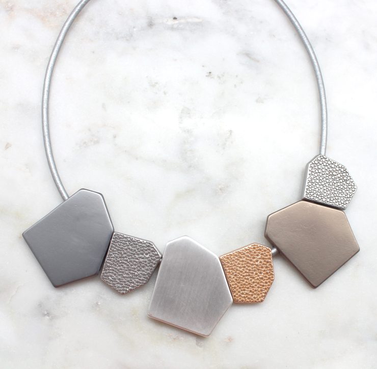 A photo of the Jagged Pieces Necklace product