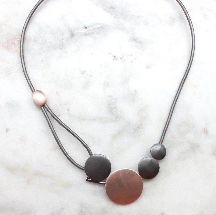 A photo of the Little Dots Necklace product