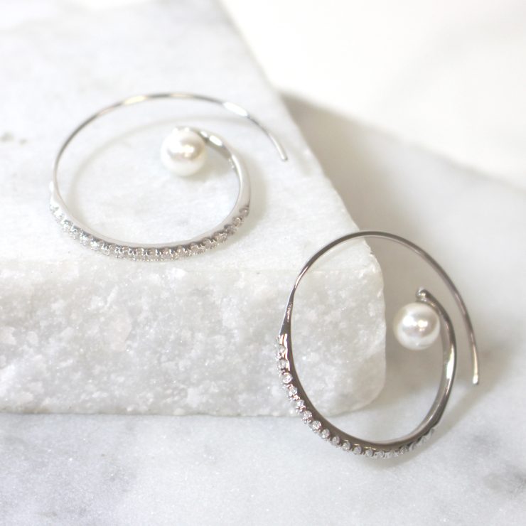 A photo of the Swirl Pearl Hoops product