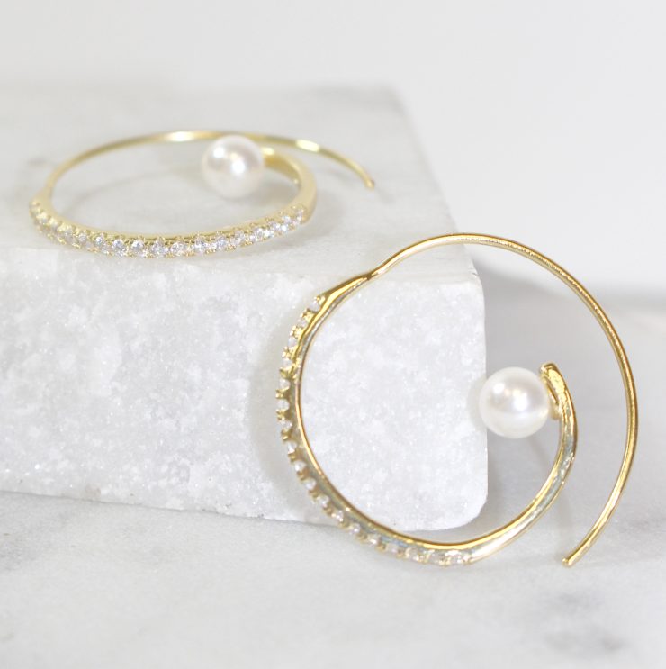 A photo of the Swirl Pearl Hoops product