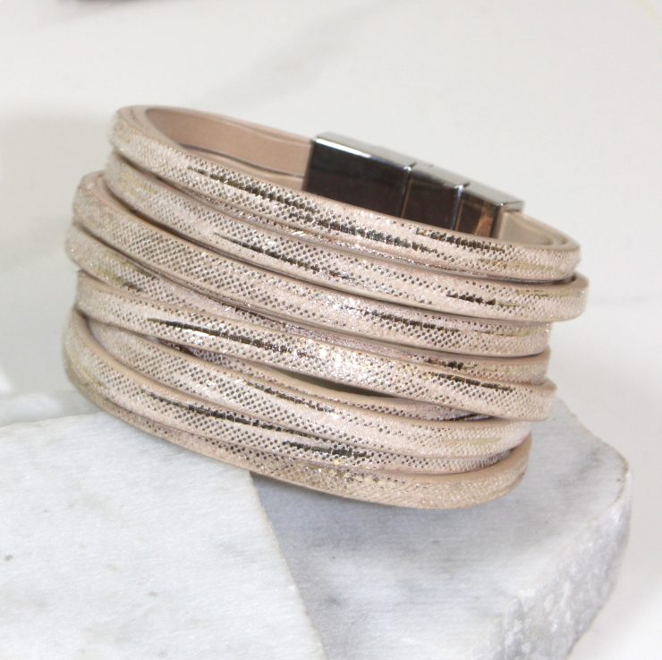A photo of the Beige Magnetic Bracelet product