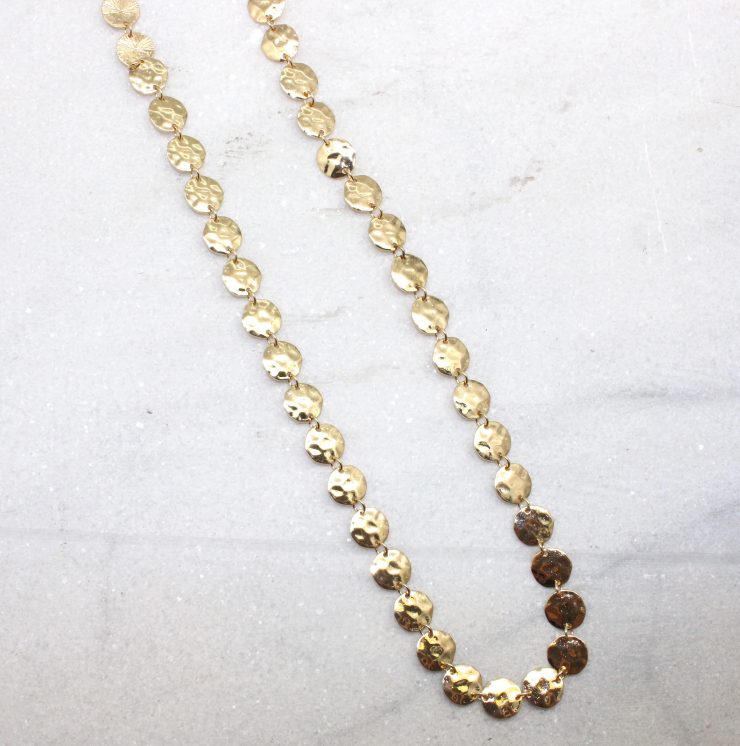 A photo of the Hammered Disc Necklace product