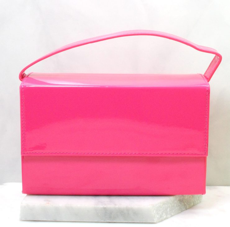 A photo of the Amelia Hand Bag in Fuchsia product