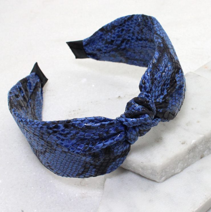 A photo of the Bitten Headband in Blue product