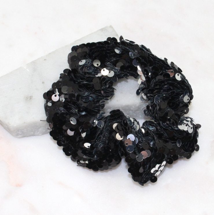 A photo of the Black and Silver Sequin Scrunchie product