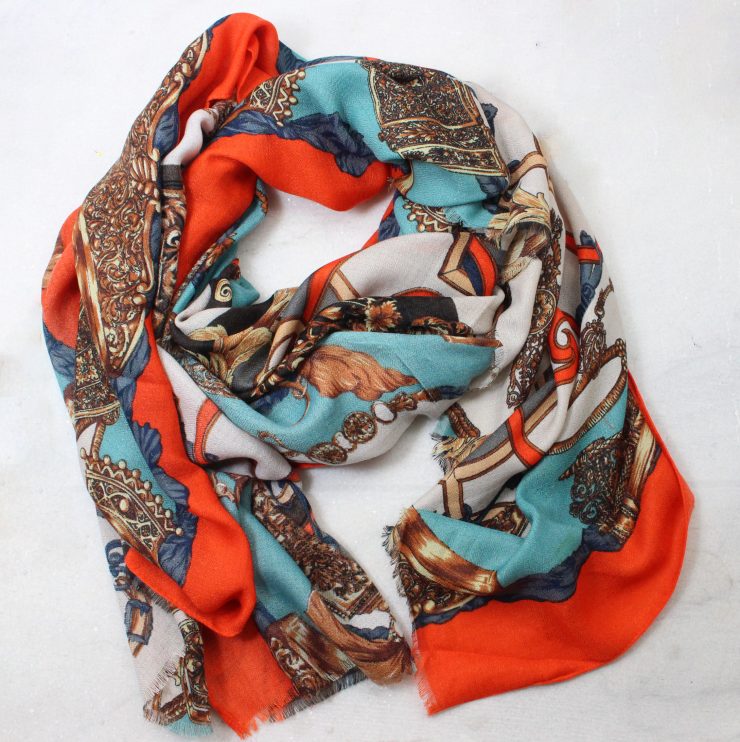 A photo of the Changing Leaves Orange Scarf product