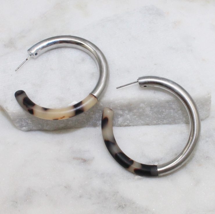 A photo of the Chloe Tortoise Shell Earrings In Silver product