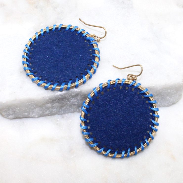 A photo of the Circling Around Earrings In Blue product