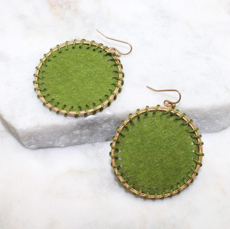A photo of the Circling Around Earrings In Green product