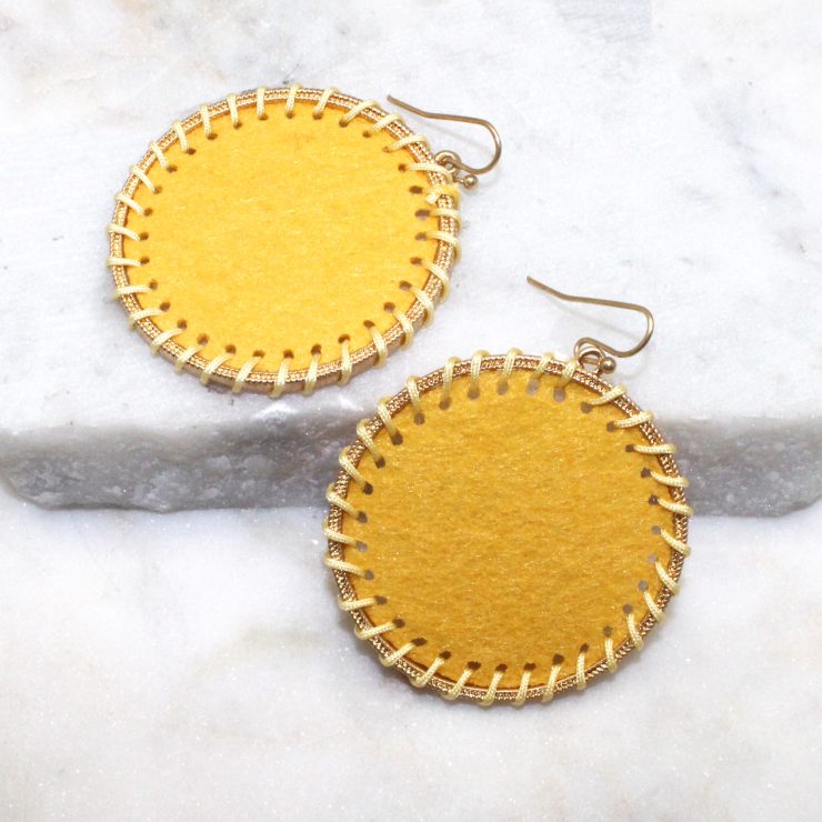 A photo of the Circling Around Earrings In Yellow product