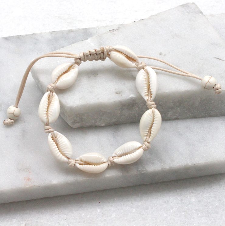 A photo of the Cowrie Bracelet in Beige product