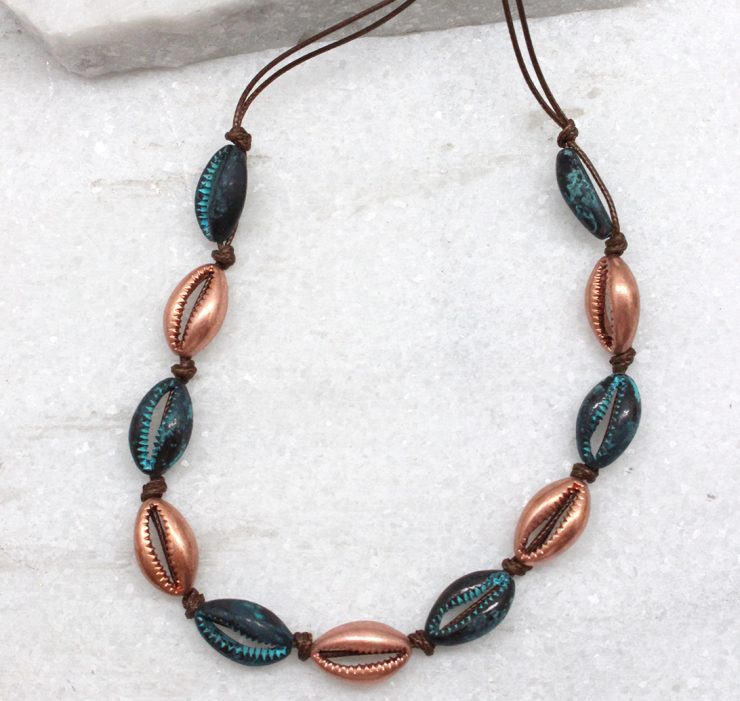 A photo of the Cowrie Knotted Necklace in Rose Gold & Turquoise product