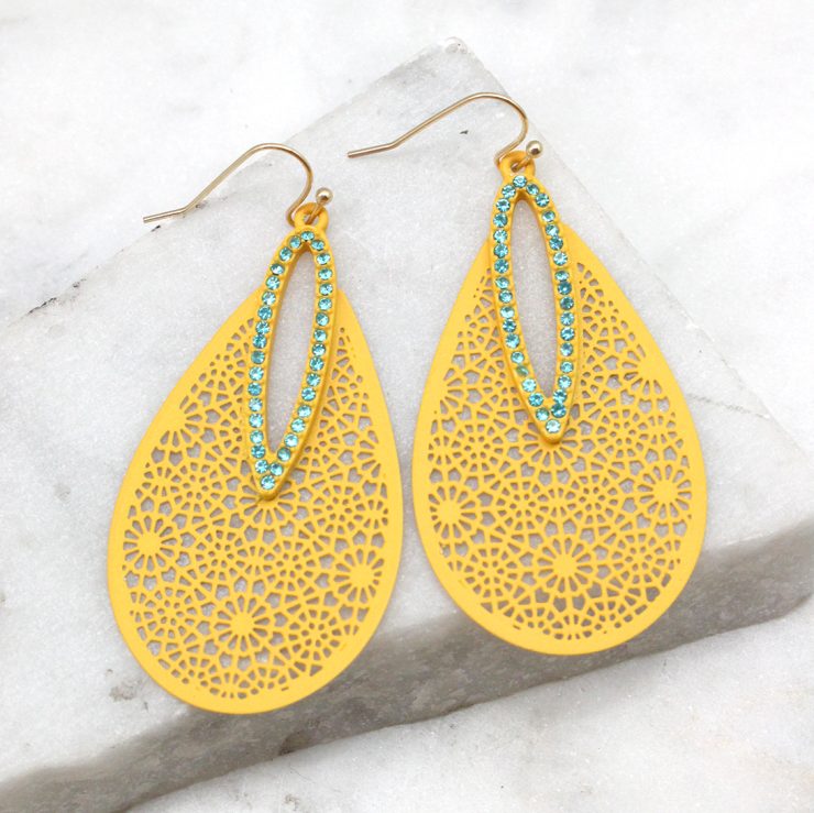 A photo of the Dazzling Cutout Earrings in Olive product