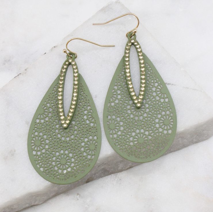 A photo of the Dazzling Cutout Earrings in Olive product