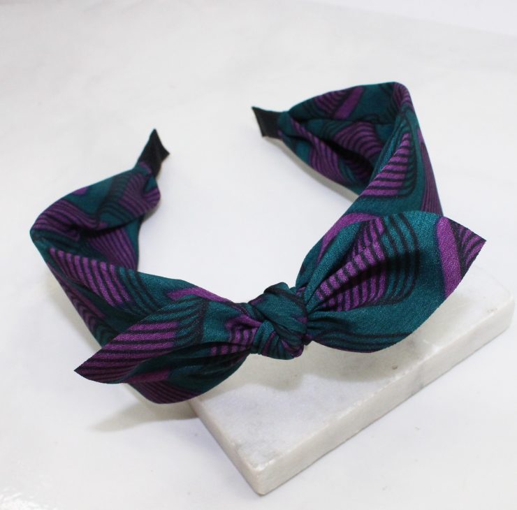 A photo of the Forest Green & Purple Swirl Headband product