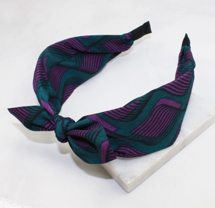 A photo of the Forest Green & Purple Swirl Headband product