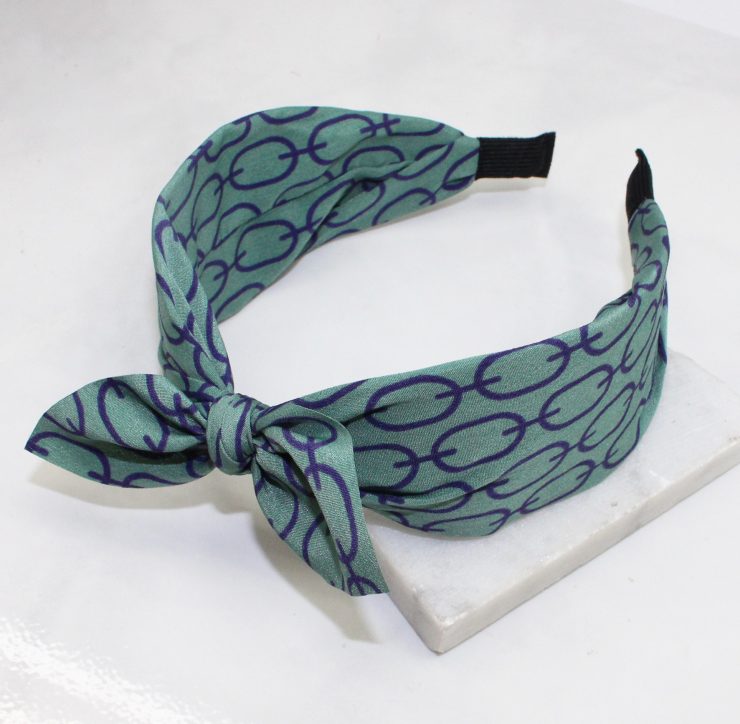 A photo of the Green & Purple Link Headband product