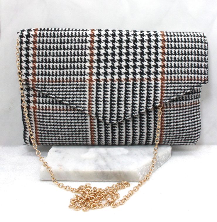 A photo of the Houndstooth Clutch in Brown product