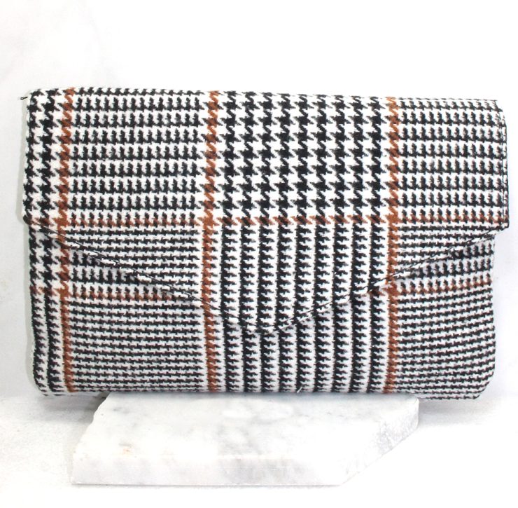 A photo of the Houndstooth Clutch in Brown product