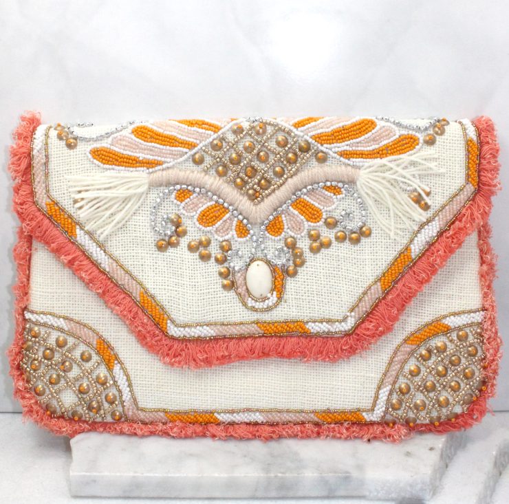 A photo of the Just Peachy Clutch product