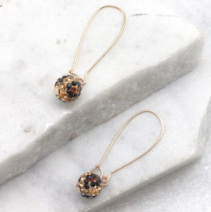 A photo of the Fireball Leopard Wire Earrings product