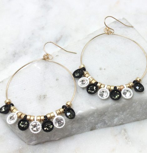 A photo of the Lost In Love Black and White Earrings product