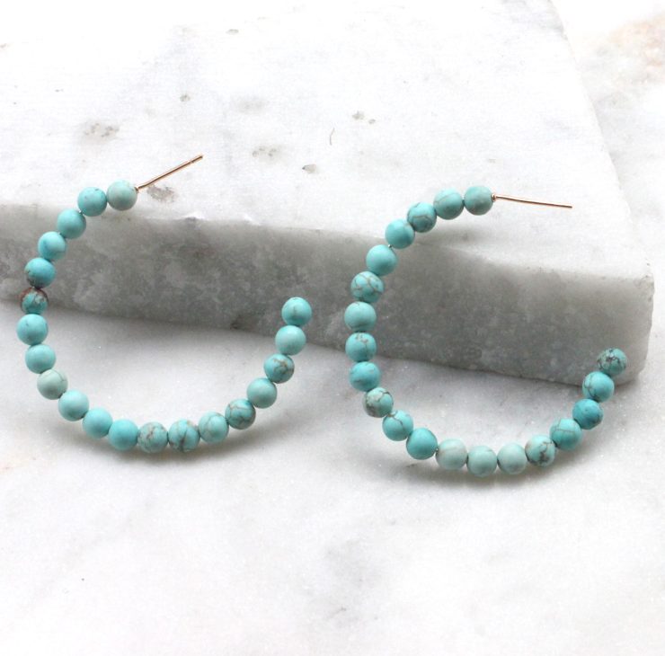 A photo of the Matte Beaded Hoops product